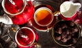 Time for a tea break. Cups of hot drink, candy and hearts Royalty Free Stock Photo