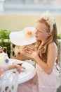 Time for tea. A sweet little girl having a tea party with her toys. Royalty Free Stock Photo