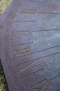 Technology: Close up of a bronze sundial on a carved stone pedestal. 3