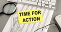 TIME TO ACTION text written on a sticky on chart with keyboard and magnifier Royalty Free Stock Photo