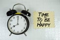 Time To Be Happy text with alarm clock on yellow background Royalty Free Stock Photo