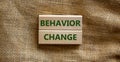 Time to behavior change symbol. Wooden blocks with words `behavior change`. Beautiful canvas background. Copy space. Business,