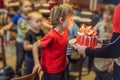 Time to blow out the candles at a child`s birthday party. 6 year old boy blows out candles on a cake Royalty Free Stock Photo