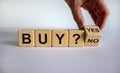 Time to buy. Hand turns a cube and changes the word `no` to `yes`. Beautiful white background. Business concept. Copy space