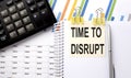 TIME TO DISRUPT text, written on a sticker with calculator,pen on chart background Royalty Free Stock Photo