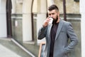 Time to drink. Bearded man drinking morning coffee. Hipster with disposable paper cup walking in city. Businessman in Royalty Free Stock Photo