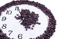 Time to drink coffee, coffee beans at the background of time Royalty Free Stock Photo