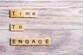 time to engage text on cubes on wooden background Royalty Free Stock Photo