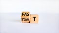 Time to fast start symbol. Turned a wooden cube with words `fast start`. Beautiful white table, white background, copy space.