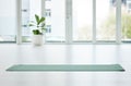 Time to get your zen on. Shot of a mat in an empty yoga studio during the day. Royalty Free Stock Photo