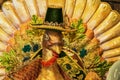 Time to give thanks - Closeup of head of Thanksgiving decorative turkey with ornate trim and pilgrim hat - Selective focus - Tail