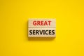 Time to great services symbol. Concept words Great services on wooden blocks on a beautiful yellow background. Business and great