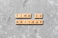 Time to holiday word written on wood block. Time to holiday text on cement table for your desing, concept Royalty Free Stock Photo