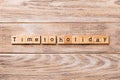 Time to holiday word written on wood block. Time to holiday text on wooden table for your desing, concept Royalty Free Stock Photo