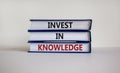 Time to invest in knowledge. Books with text 'invest in knowledge'