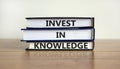 Time to invest in knowledge. Books with text 'invest in knowledge'