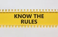 Time to know the rules. White and yellow paper with words `know the rules`. Beautiful yellow background. Business and know the