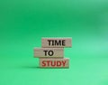 Time to learn symbol. Wooden blocks with words Time to learn. Beautiful green background. Business and Time to learn concept. Copy