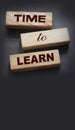 Time to Learn on wooden blocks put black. Education concept. Life-time learning business concept Royalty Free Stock Photo