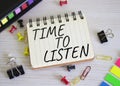 Time to listen symbol. Concept words Time to listen on white notebook. Beautiful wooden background. Business and Active listening Royalty Free Stock Photo