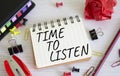 Time to listen symbol. Concept words Time to listen on white notebook. Beautiful wooden background. Business and Active listening Royalty Free Stock Photo