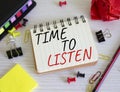 Time to listen symbol. Concept words Time to listen on white notebook. Beautiful wooden background. Business and Active listening Royalty Free Stock Photo