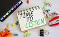 Time to listen symbol. Concept words Time to listen on white notebook. Beautiful wooden background. Business and Active listening Royalty Free Stock Photo