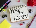 Time to listen symbol. Concept words Time to listen on white notebook. Beautiful wooden background. Business and Active listening Royalty Free Stock Photo