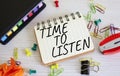 Time to listen symbol. Concept words Time to listen on white notebook. Beautiful wooden background. Business and Active listening Royalty Free Stock Photo