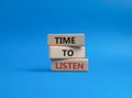 Time to listen symbol. Wooden blocks with words Time to listen. Beautiful blue background. Business and Active listening concept. Royalty Free Stock Photo