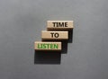 Time to listen symbol. Wooden blocks with words Time to listen. Beautiful grey background. Business and Active listening concept. Royalty Free Stock Photo