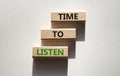 Time to listen symbol. Wooden blocks with words Time to listen. Beautiful white background. Business and Active listening concept Royalty Free Stock Photo