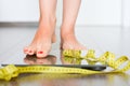 Time to lose kilograms with woman feet stepping on a weight scale Royalty Free Stock Photo