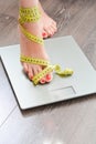 Time to lose kilograms with woman feet stepping on a weight scale Royalty Free Stock Photo