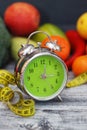 Time to lose Weight. Fruit, Vegetable and Alarm Clock on the table, Diet and Fitness concept. Royalty Free Stock Photo