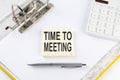 TIME TO MEETING - business concept, message on the sticker on folder background with calculator