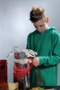 Boy wrapping up christmas gifts