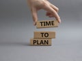 Time to plan symbol. Wooden blocks with words Time to plan. Beautiful grey background. Businessman hand. Business and Time to plan Royalty Free Stock Photo