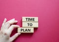 Time to plan symbol. Wooden blocks with words Time to plan. Beautiful red background. Businessman hand. Business and Time to plan Royalty Free Stock Photo