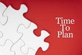 TIME TO PLAN text with jigsaw puzzle on red background.