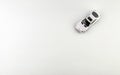 Time to play. A little toy, a small white car on a white background. Royalty Free Stock Photo