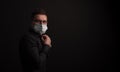 is time to protect all the time. elegant man wearing a mouth protection to prevent getting sick at work or on the way to work