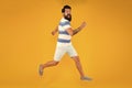 Time to relax. active runner in move. Hurry up. Summer vacation. Man bearded hipster run yellow wall. Guy beard striped