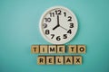 Time To Relax alphabet letter with alarm clock on blue background