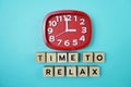 Time To Relax alphabet letter with alarm clock on blue background Royalty Free Stock Photo