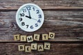 Time To Relax alphabet letter with alarm clock on wooden background