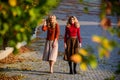 Time to relax. girls in corrugated skirt and sweater. female beauty. real femininity. autumn women outdoor. girl friends