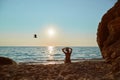 Time to relax, summer time and holiday trip idea, copy space. Girl watch sunset over sea. Beautiful landscape on beach. Royalty Free Stock Photo