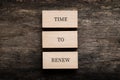 Time to renew sign spelled on three stacked wooden blocks Royalty Free Stock Photo