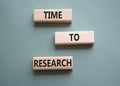 Time to Research symbol. Concept word Time to Research on wooden blocks. Beautiful grey green background. Business and Time to Royalty Free Stock Photo